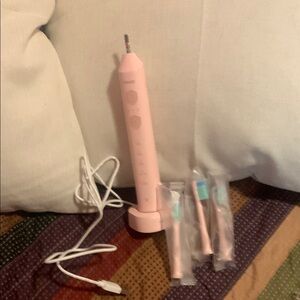 Pink Sonicare Electric Toothbrush with Extra Heads